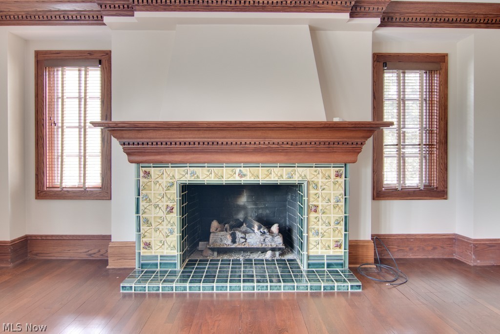 844 Merriman Road Akron, OH 44303 - Photo 3 of 34 Living room off Foyer. Look at the craftsmanship: crown molding matches fireplace mantle and beautiful tile surround and hearth. Gleaming hardwood floors too!