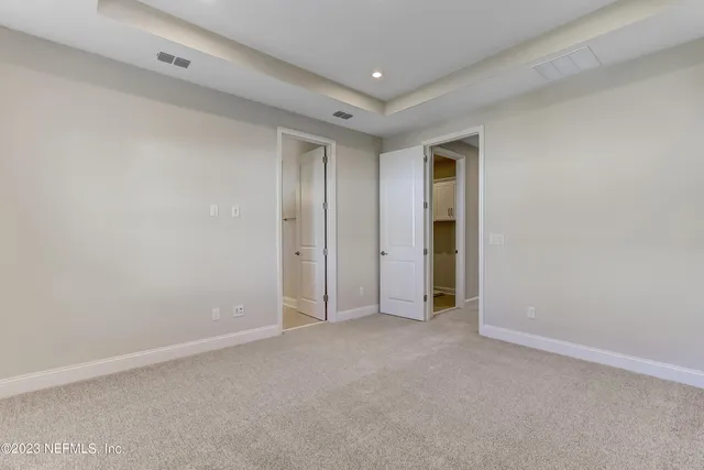 a bathroom with a shower sink and mirror