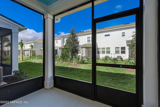 a sign that is in front of flowers