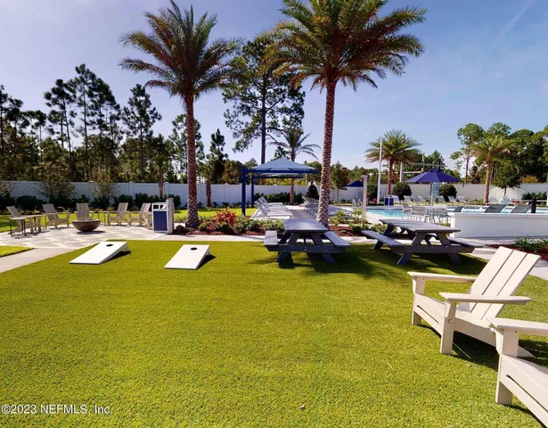 a outdoor dining space with furniture and garden view