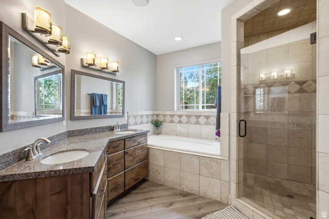 3148 Lower Saddleback Road Park City, UT 84098 - Photo 42 of 67 Bathroom featuring a glass-enclosed shower, a deep soaking tub, and a double vanity with stone countertops