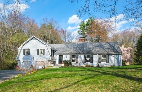123 Draper Road Wayland, MA 01778 - Photo 1 of 30 a front view of a house with a garden and porch