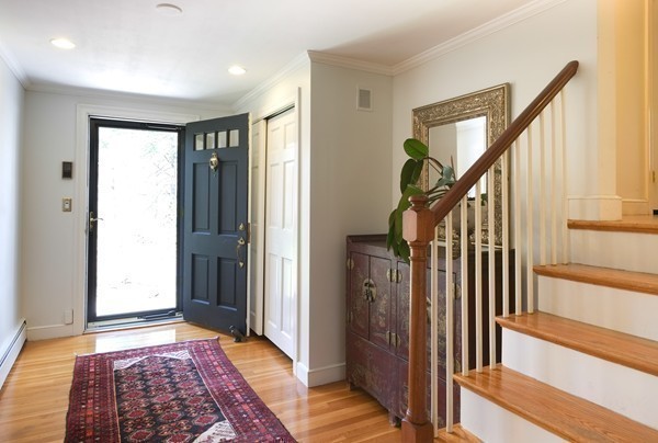123 Draper Road Wayland, MA 01778 - Photo 15 of 30 a view of a hallway with wooden floor and stairs