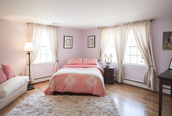123 Draper Road Wayland, MA 01778 - Photo 19 of 30 a spacious bedroom with a bed and wooden floor