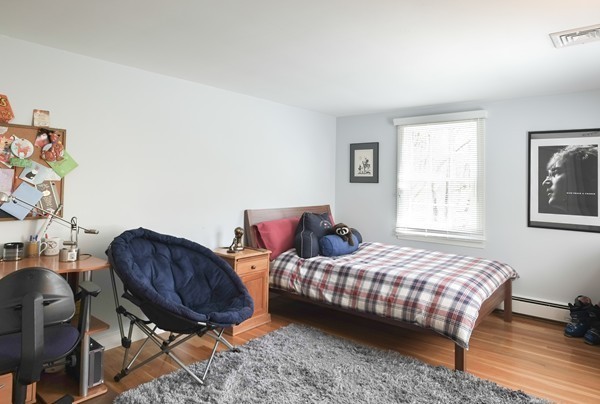 123 Draper Road Wayland, MA 01778 - Photo 20 of 30 a bedroom with two beds and a chair