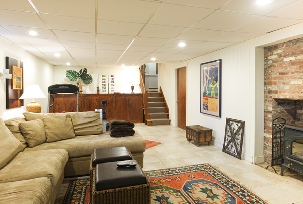 123 Draper Road Wayland, MA 01778 - Photo 23 of 30 a living room with furniture and a flat screen tv