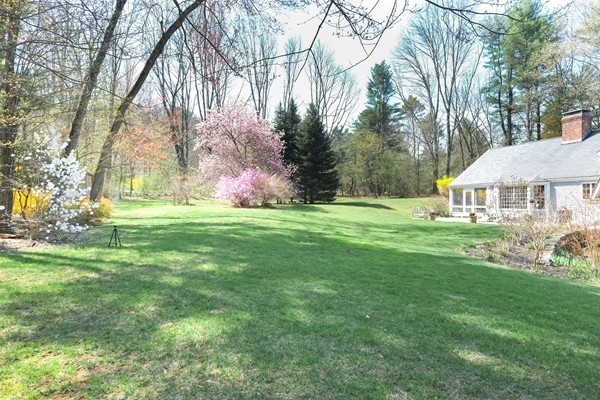 123 Draper Road Wayland, MA 01778 - Photo 27 of 30 a front view of a house with garden