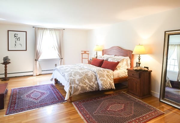 123 Draper Road Wayland, MA 01778 - Photo 6 of 30 a spacious bedroom with a bed and a couch