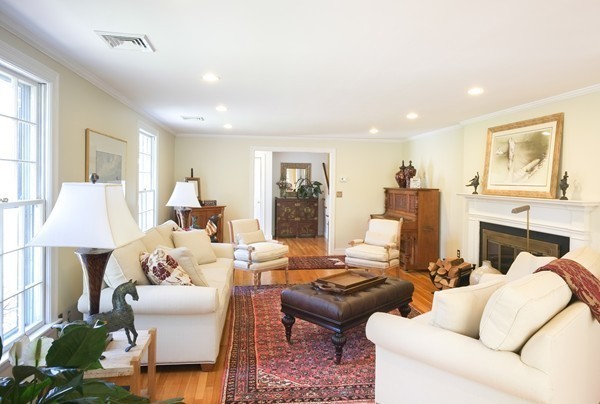 123 Draper Road Wayland, MA 01778 - Photo 7 of 30 a living room with furniture and a fireplace