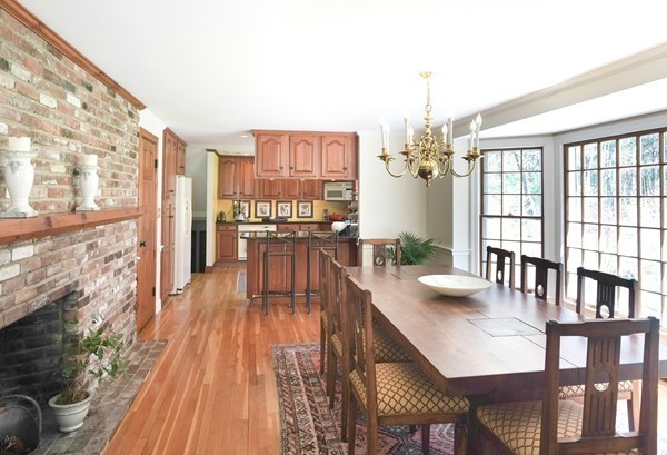 123 Draper Road Wayland, MA 01778 - Photo 8 of 30 a view of a dining room with furniture a chandelier and wooden floor