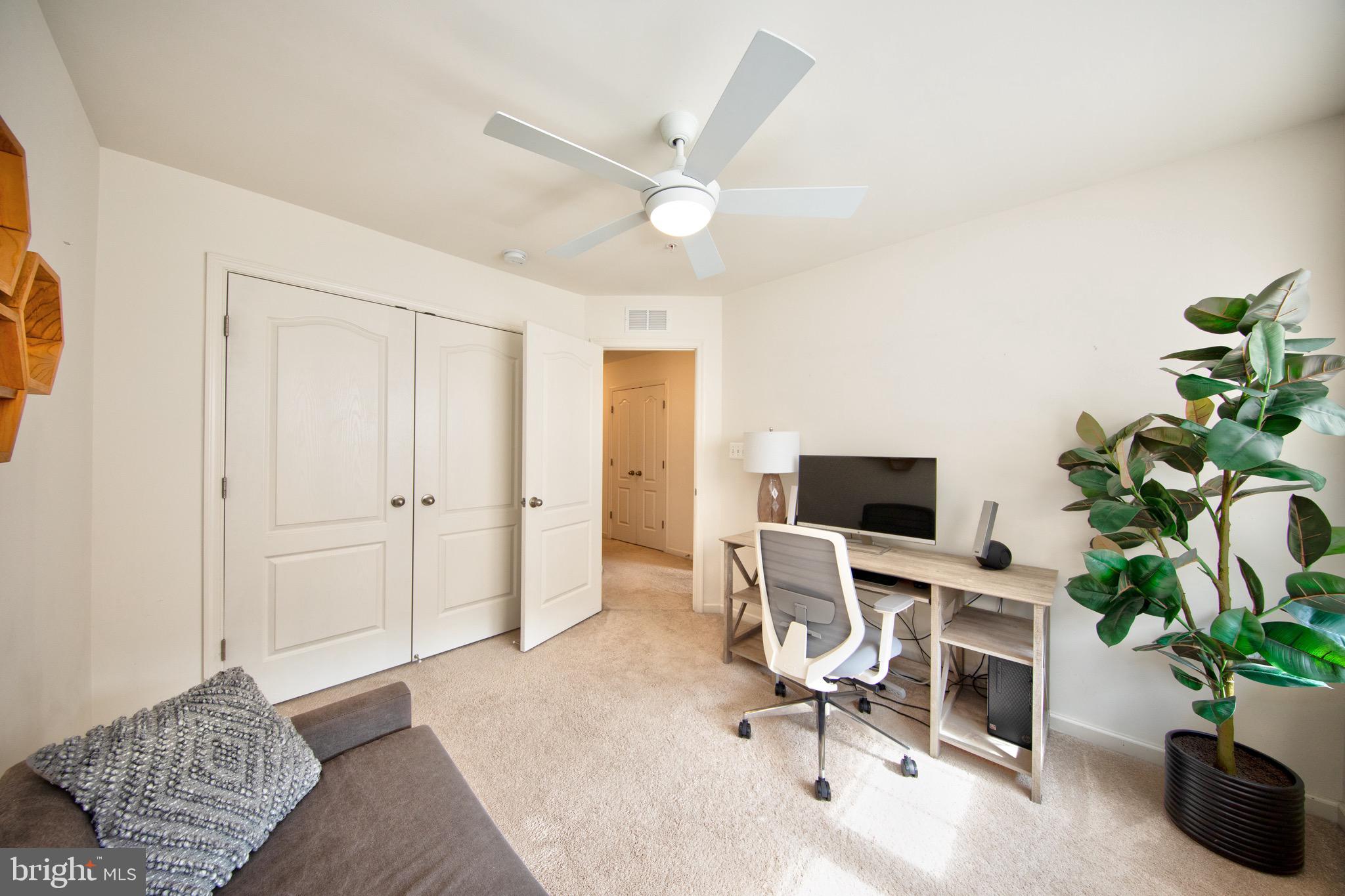 909 Morgan Run Road Baltimore, MD 21220 - Photo 27 of 41 a workspace with a couch and a potted plant
