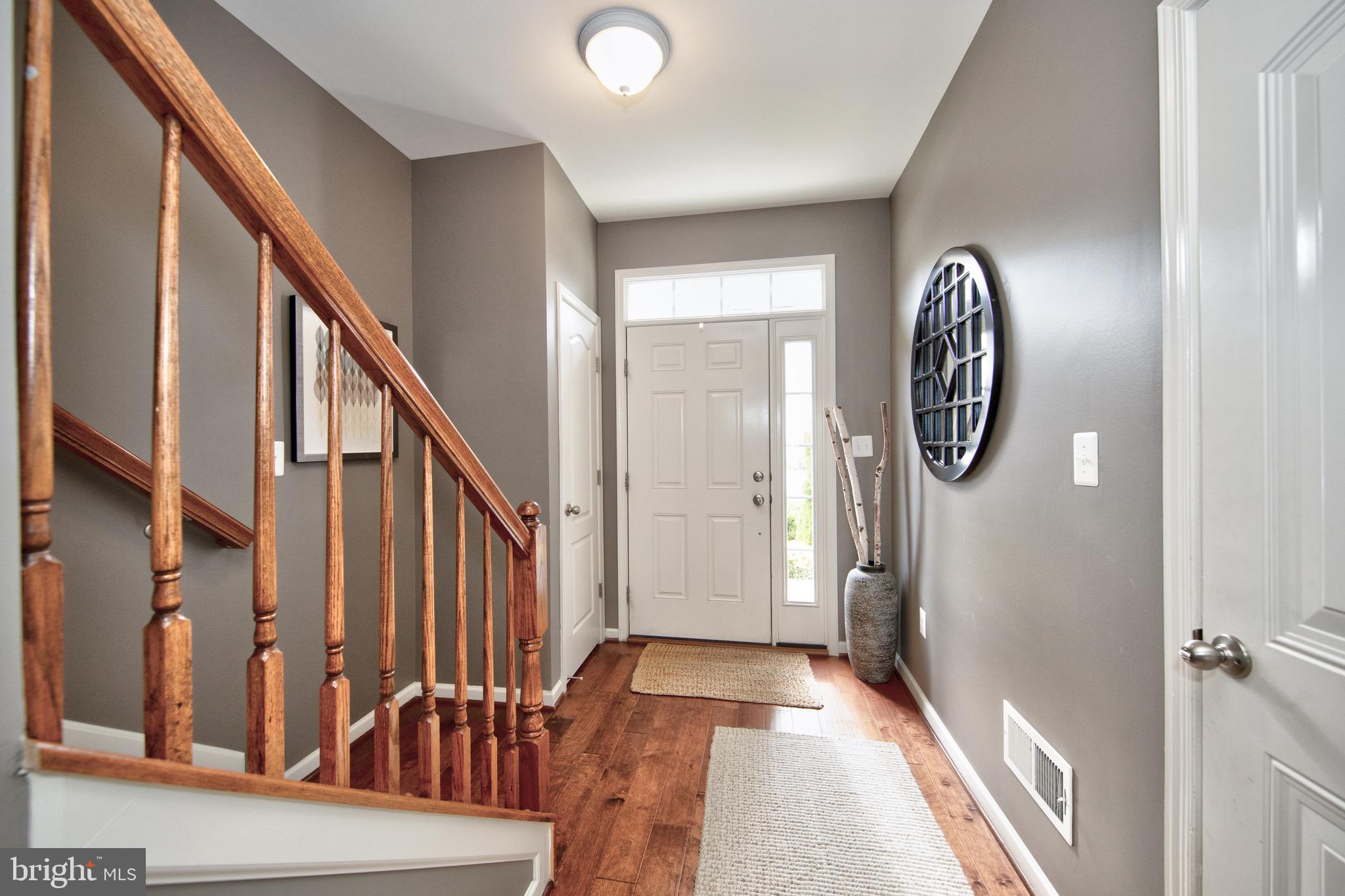 909 Morgan Run Road Baltimore, MD 21220 - Photo 3 of 41 a view of a hallway with wooden floor and entryway