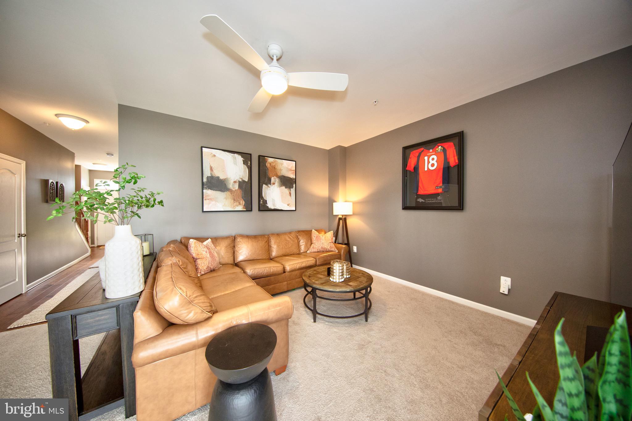 909 Morgan Run Road Baltimore, MD 21220 - Photo 6 of 41 a living room with furniture and a flat screen tv