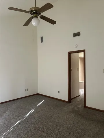 a view of empty room with windows