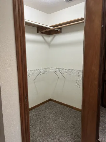 a bathroom with a tub and toilet