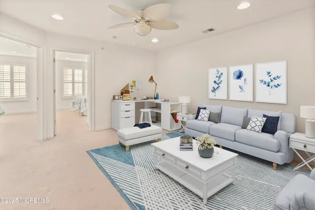 a living room with furniture and a table