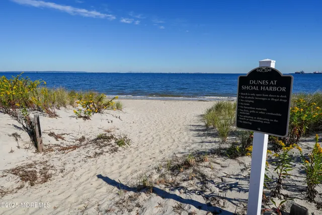 a view of a dry yard with wooden fence