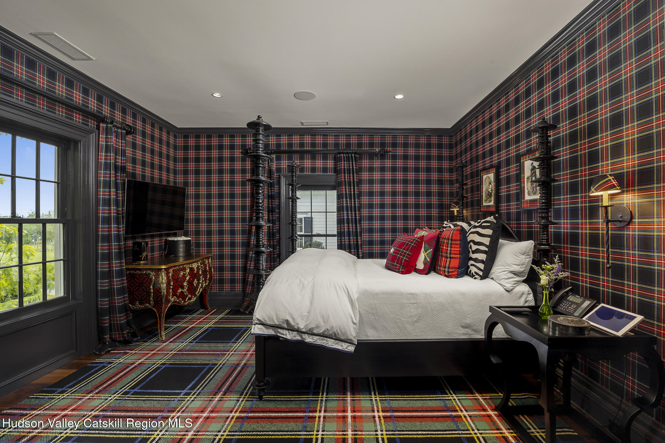 309 Woodstock Road Millbrook, NY 12545 - Photo 16 of 51 a bedroom with a bed and a walk in closet with wooden floor