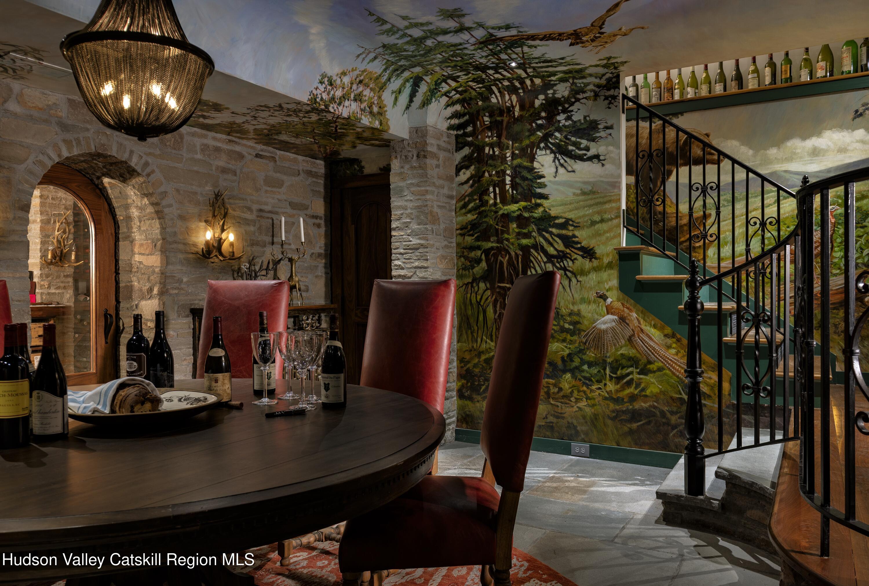 309 Woodstock Road Millbrook, NY 12545 - Photo 29 of 51 a view of a dining room with furniture and chandelier