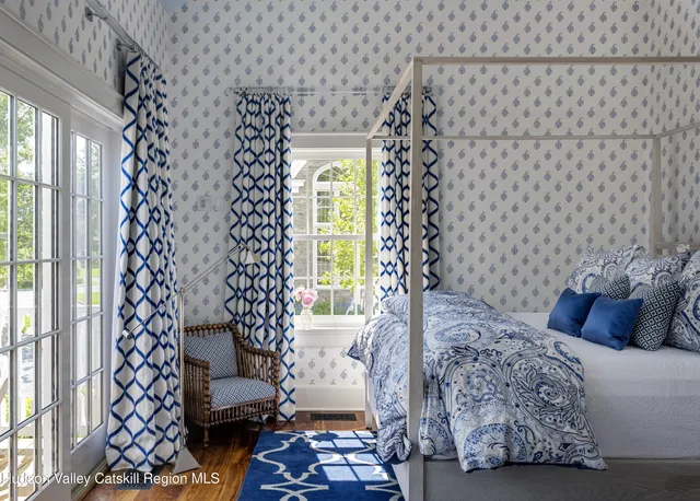 a living room with furniture and a glass door