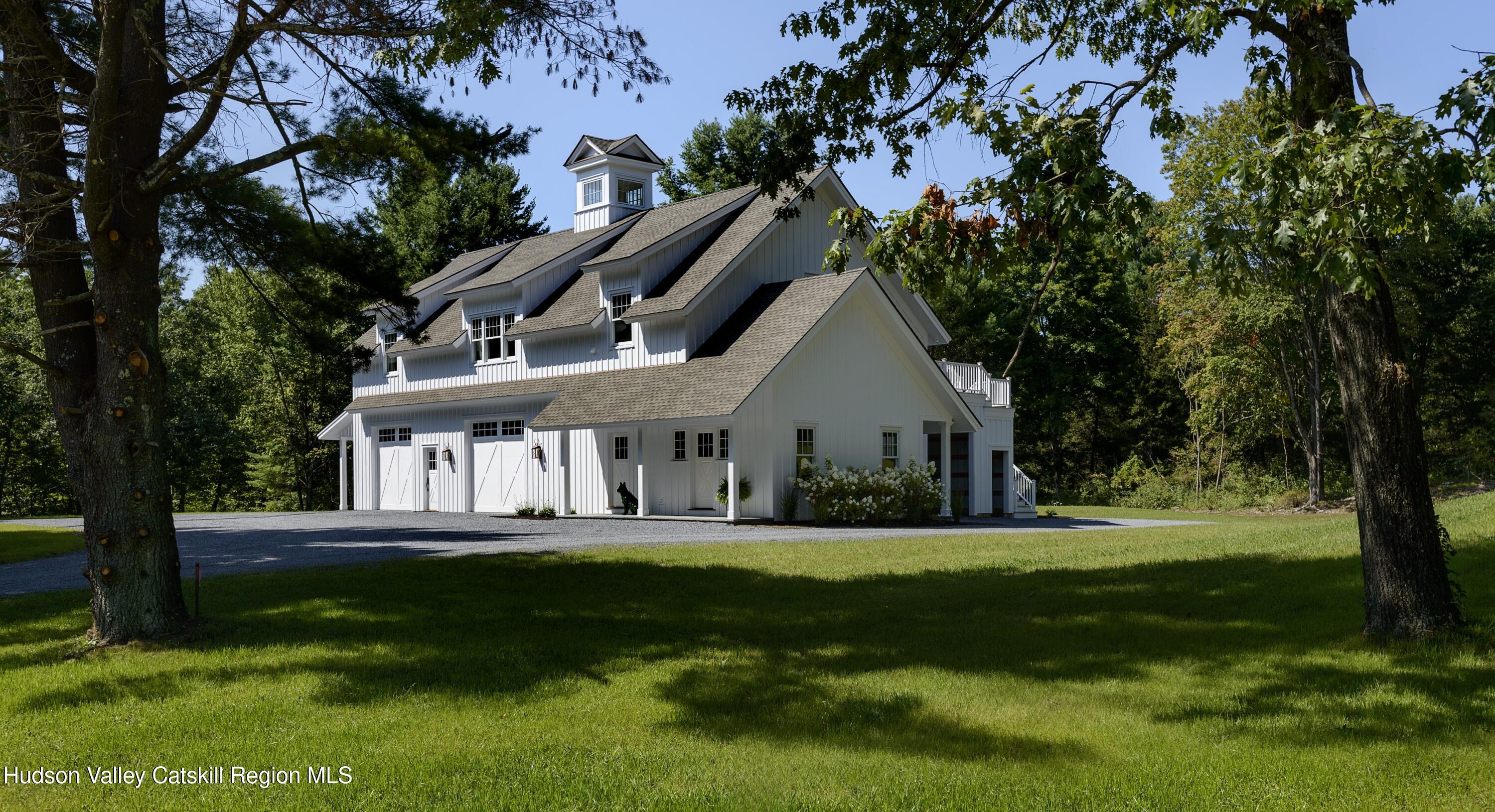 309 Woodstock Road Millbrook, NY 12545 - Photo 43 of 51 a front view of a house with a yard