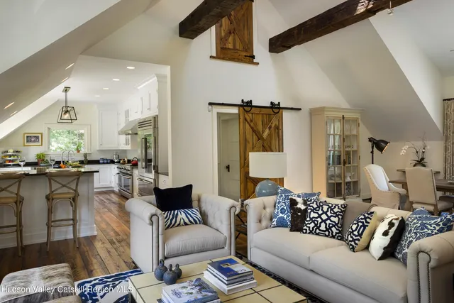 a bedroom with a bed couch and window