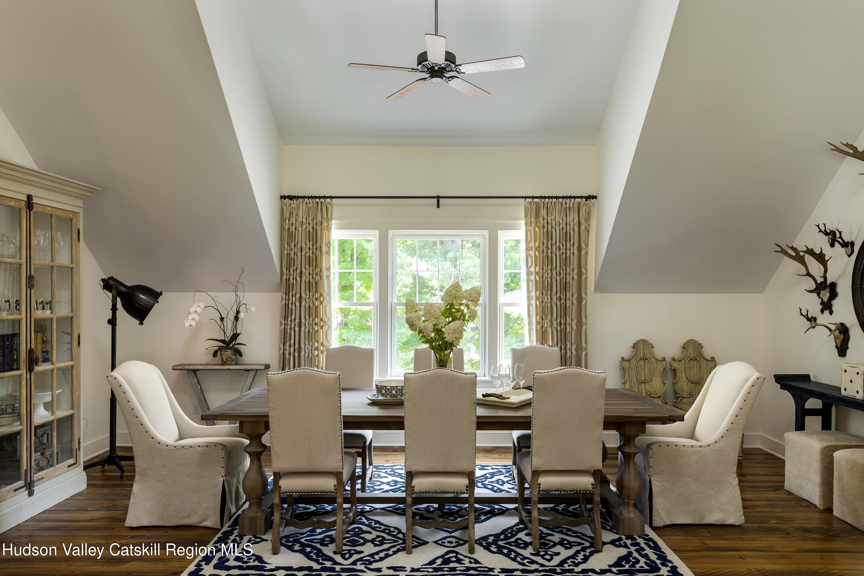 309 Woodstock Road Millbrook, NY 12545 - Photo 45 of 51 a view of a dining room with furniture window and outside view