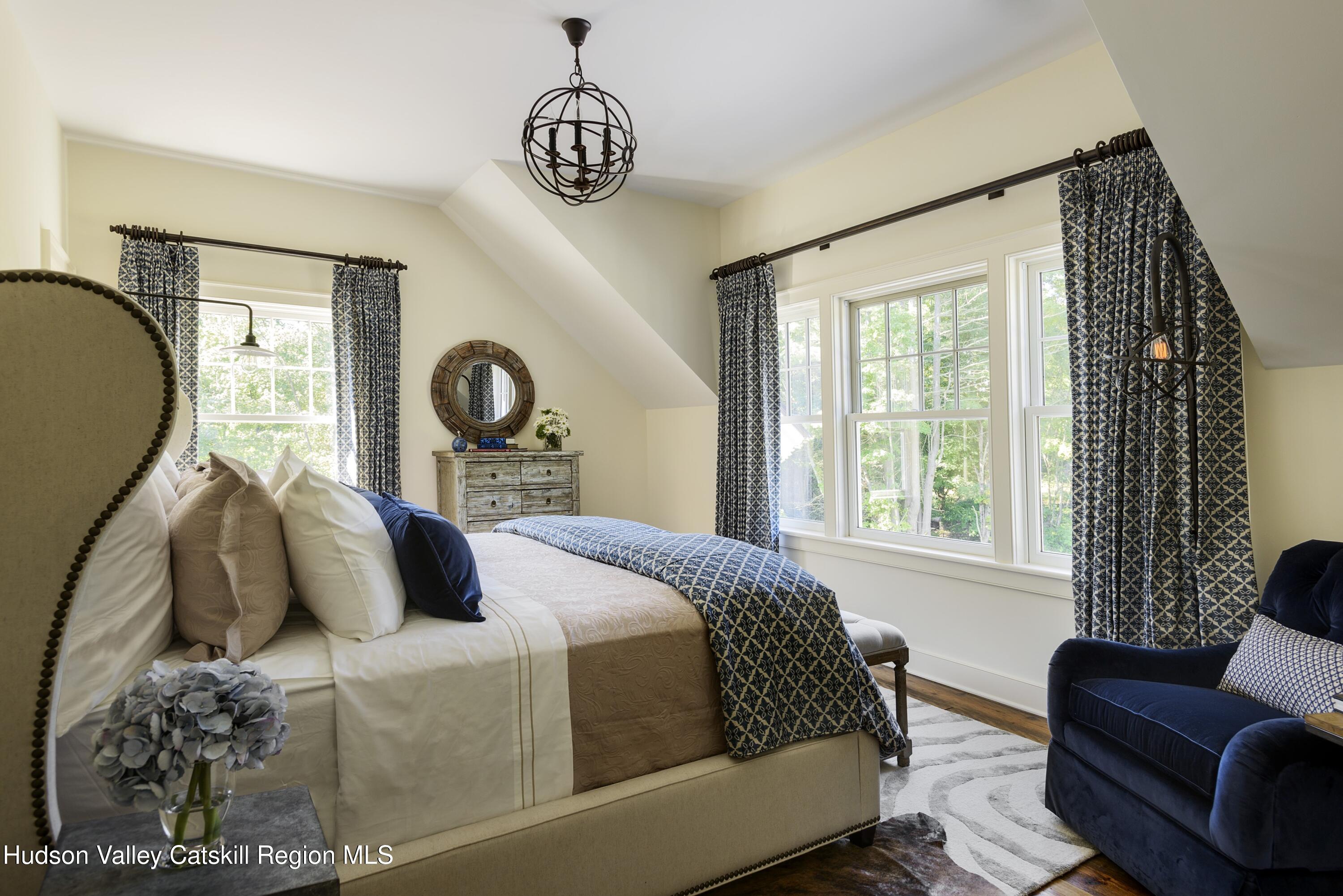 309 Woodstock Road Millbrook, NY 12545 - Photo 47 of 51 a bedroom with a bed couch and window