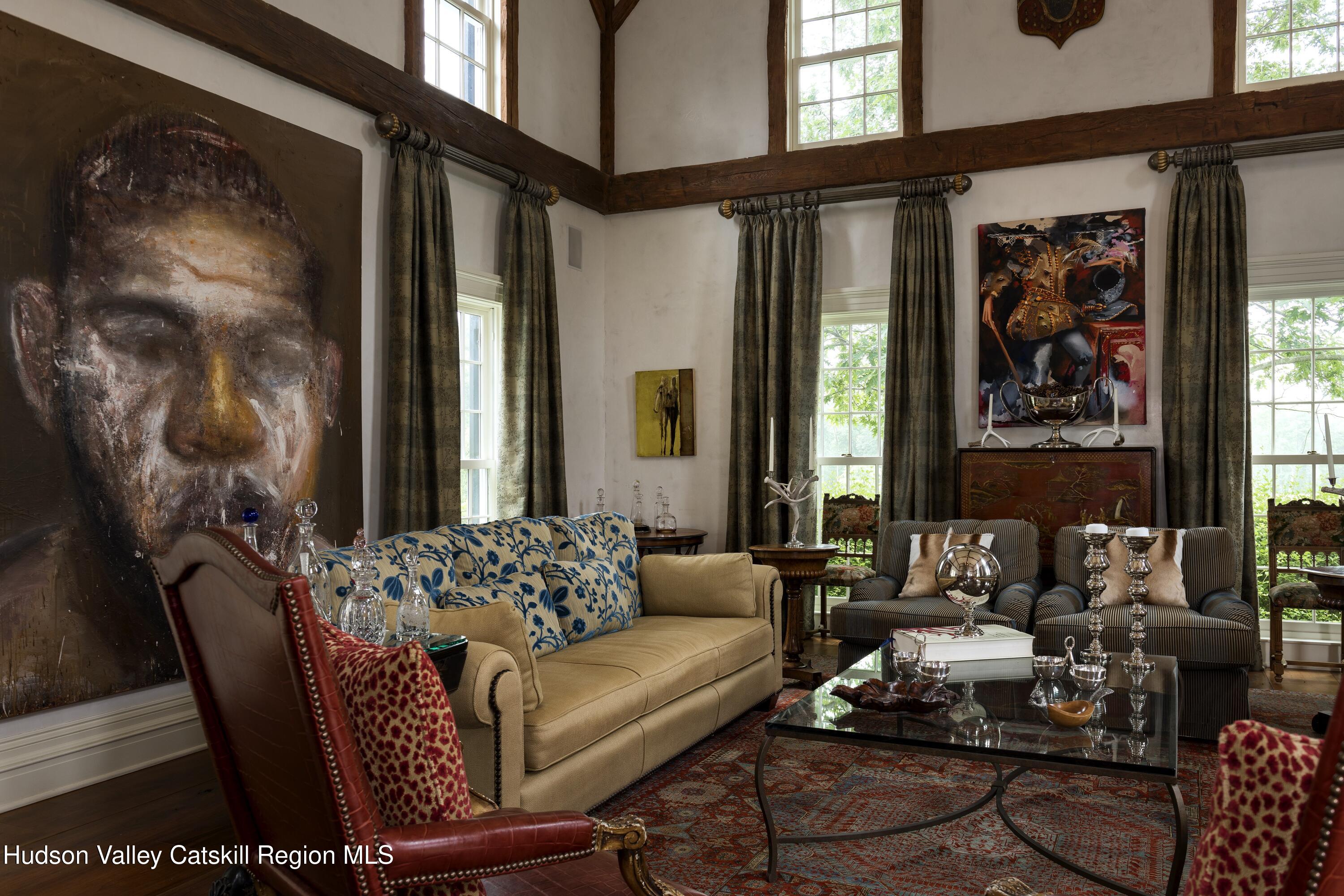 309 Woodstock Road Millbrook, NY 12545 - Photo 8 of 51 a living room with furniture and a large window