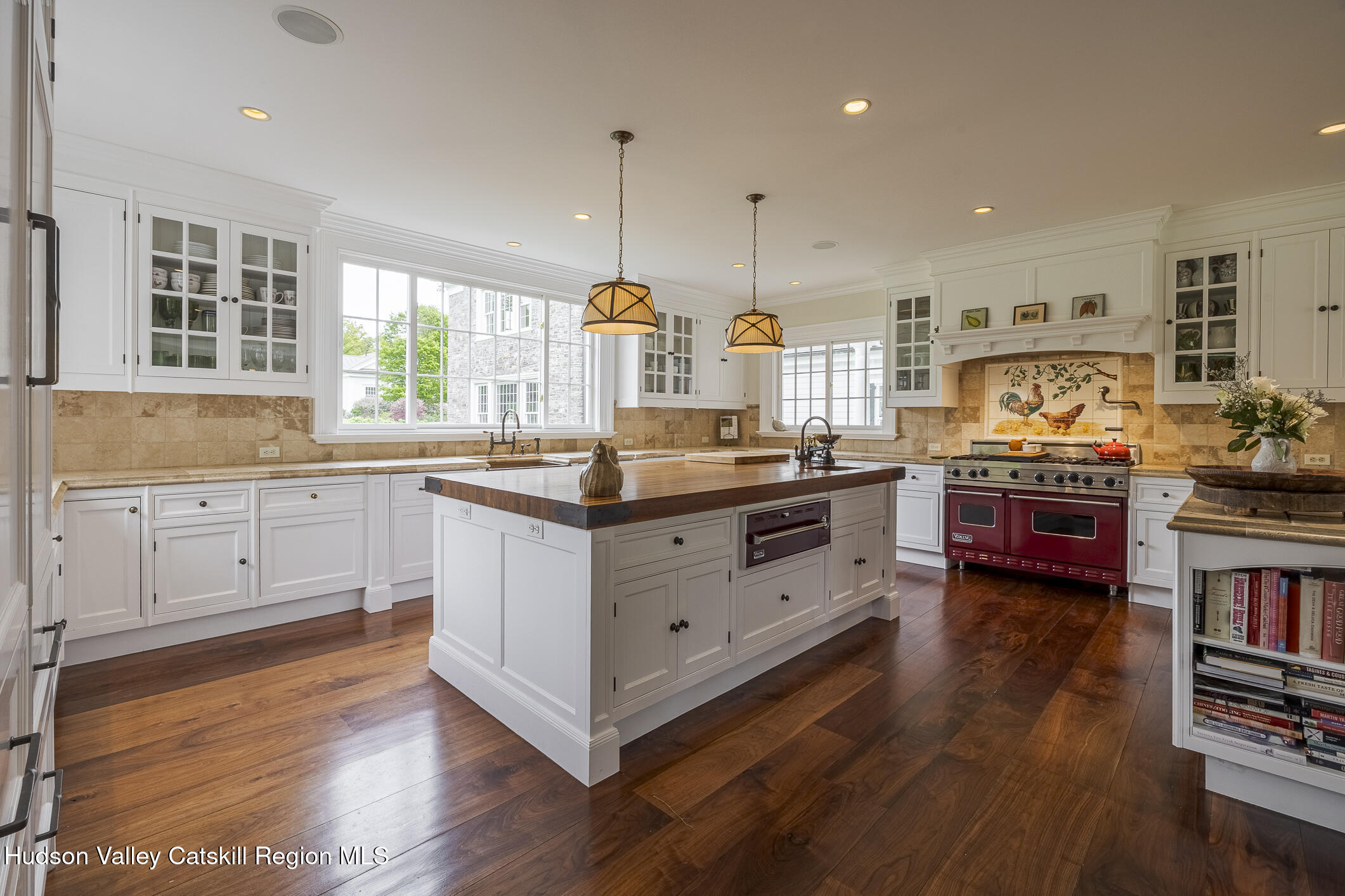 309 Woodstock Road Millbrook, NY 12545 - Photo 10 of 51 a kitchen with stainless steel appliances granite countertop a stove and a wooden floors