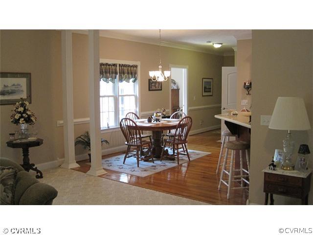 11928 Winterpock Road Chesterfield, VA 23838 - Photo 5 of 12 a living room with furniture a window and a chandelier
