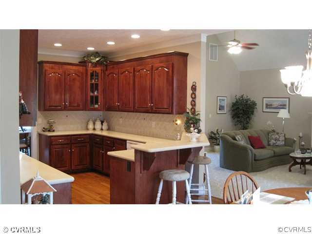 11928 Winterpock Road Chesterfield, VA 23838 - Photo 6 of 12 a kitchen with a sink cabinets and wooden floor
