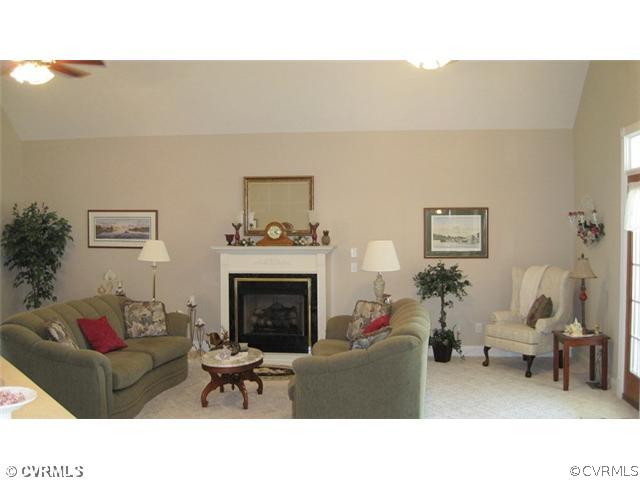 11928 Winterpock Road Chesterfield, VA 23838 - Photo 7 of 12 a living room with furniture and a fireplace