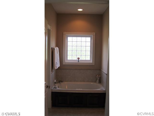 11928 Winterpock Road Chesterfield, VA 23838 - Photo 9 of 12 a bathroom with a sink and a bathtub