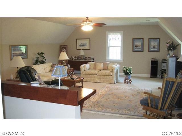 11928 Winterpock Road Chesterfield, VA 23838 - Photo 10 of 12 a living room with furniture and a fireplace