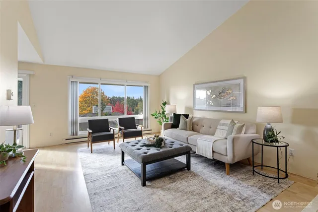 a living room with furniture and a large window