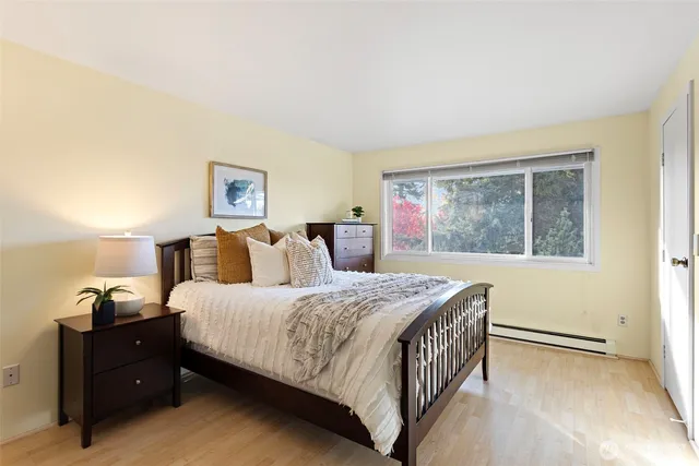 a bedroom with a bed and a window