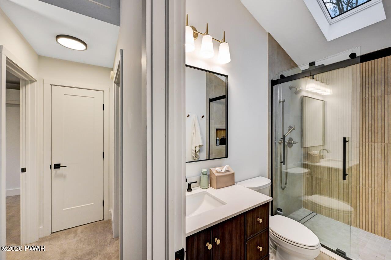 258 Lakeview Road Lackawaxen, PA 18435 - Photo 51 of 119 a bathroom with a sink a toilet a mirror and shower