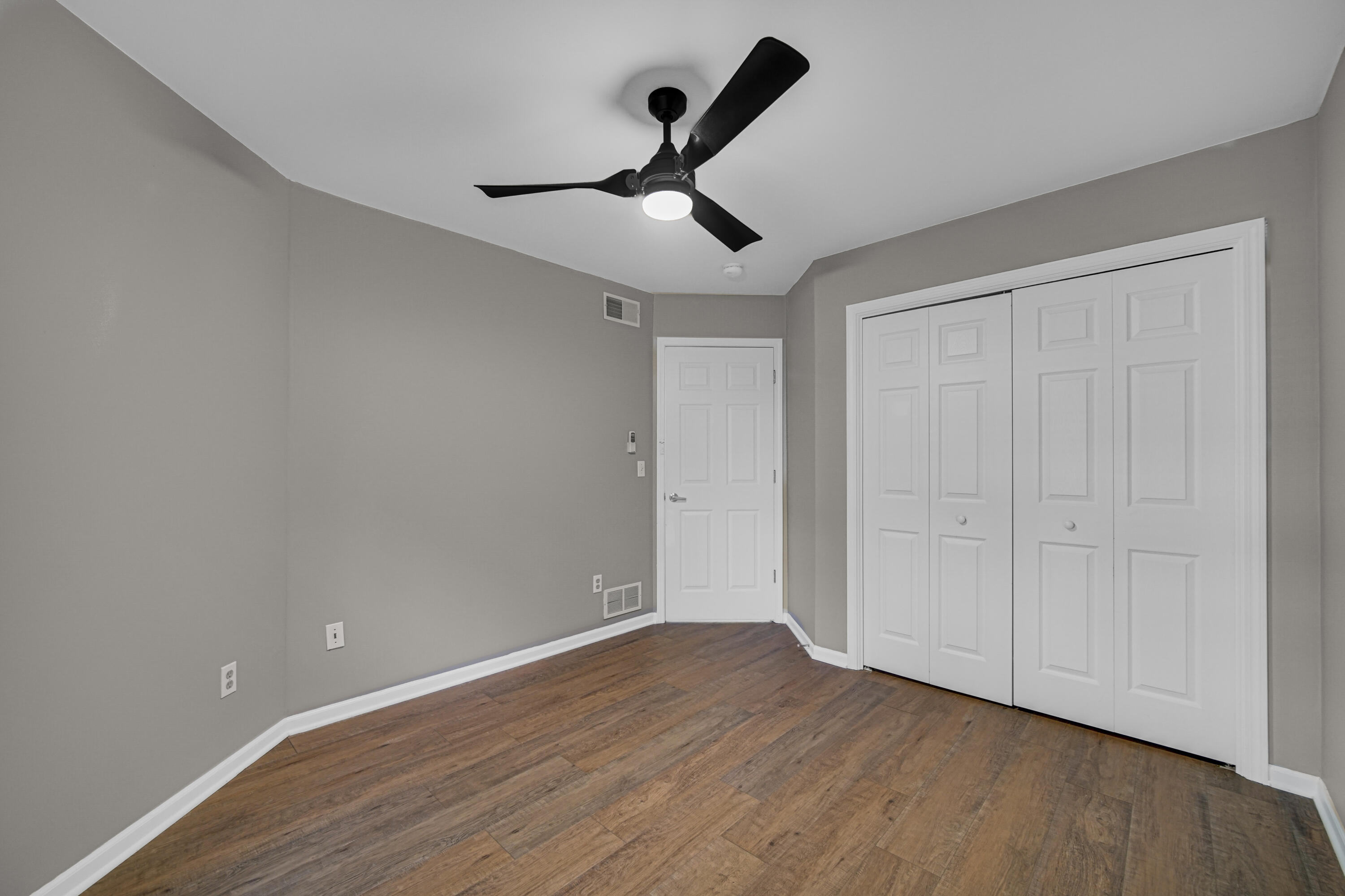 11130 Allendale Court Crown Point, IN 46307 - Photo 12 of 21 a view of empty room with wooden floor and ceiling fan