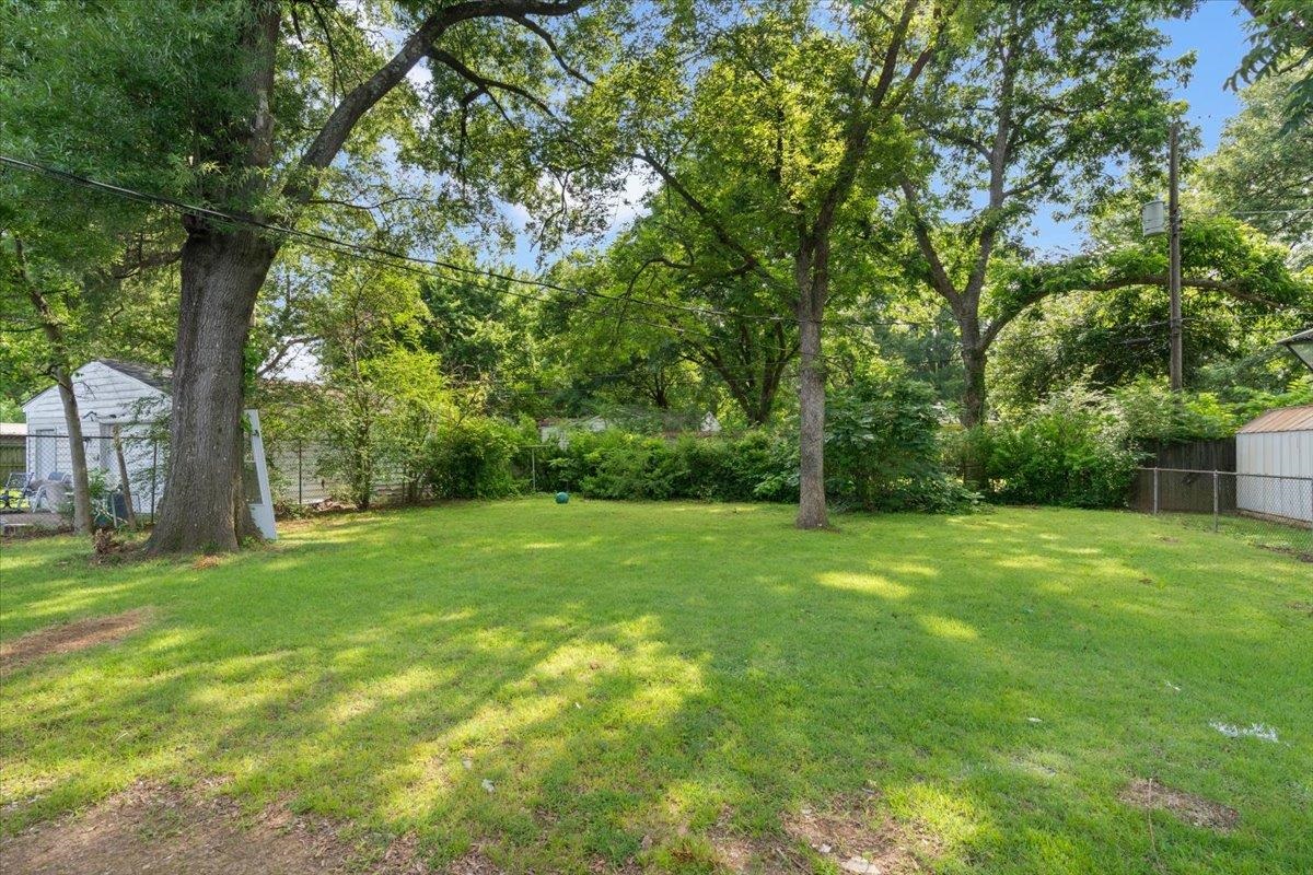2717 Merle Street Memphis, TN 38118 - Photo 16 of 18 Expansive green lawn framed by mature trees