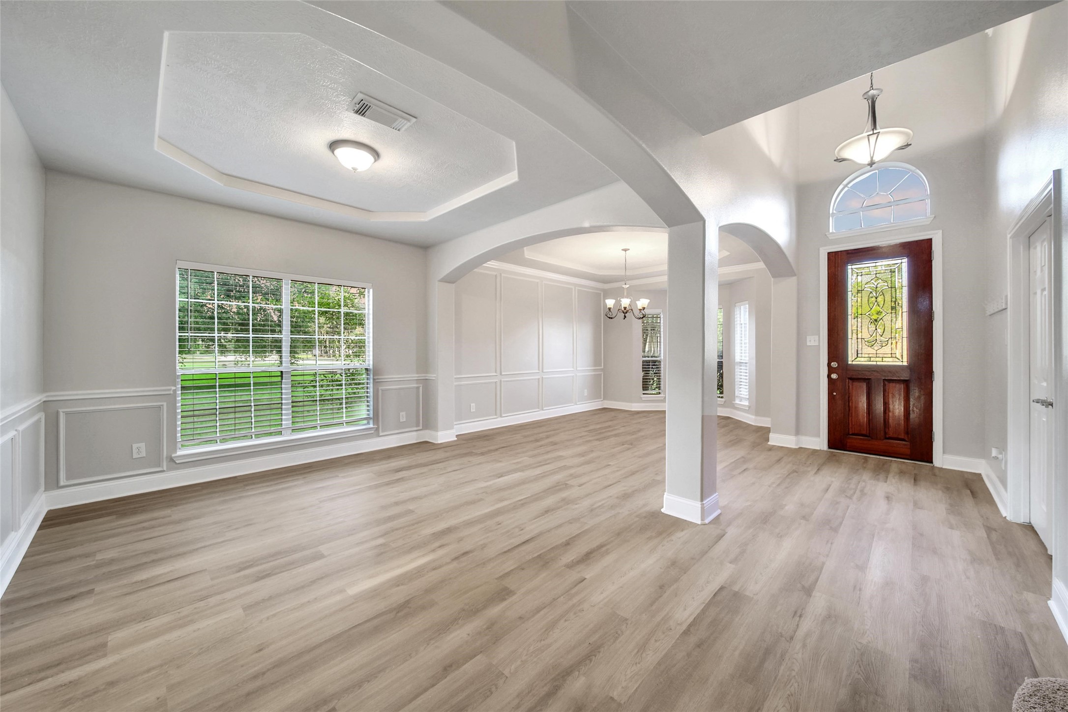 2315 Legends Gate Drive Spring, TX 77386 - Photo 13 of 50 a view of an empty room with wooden floor and a window