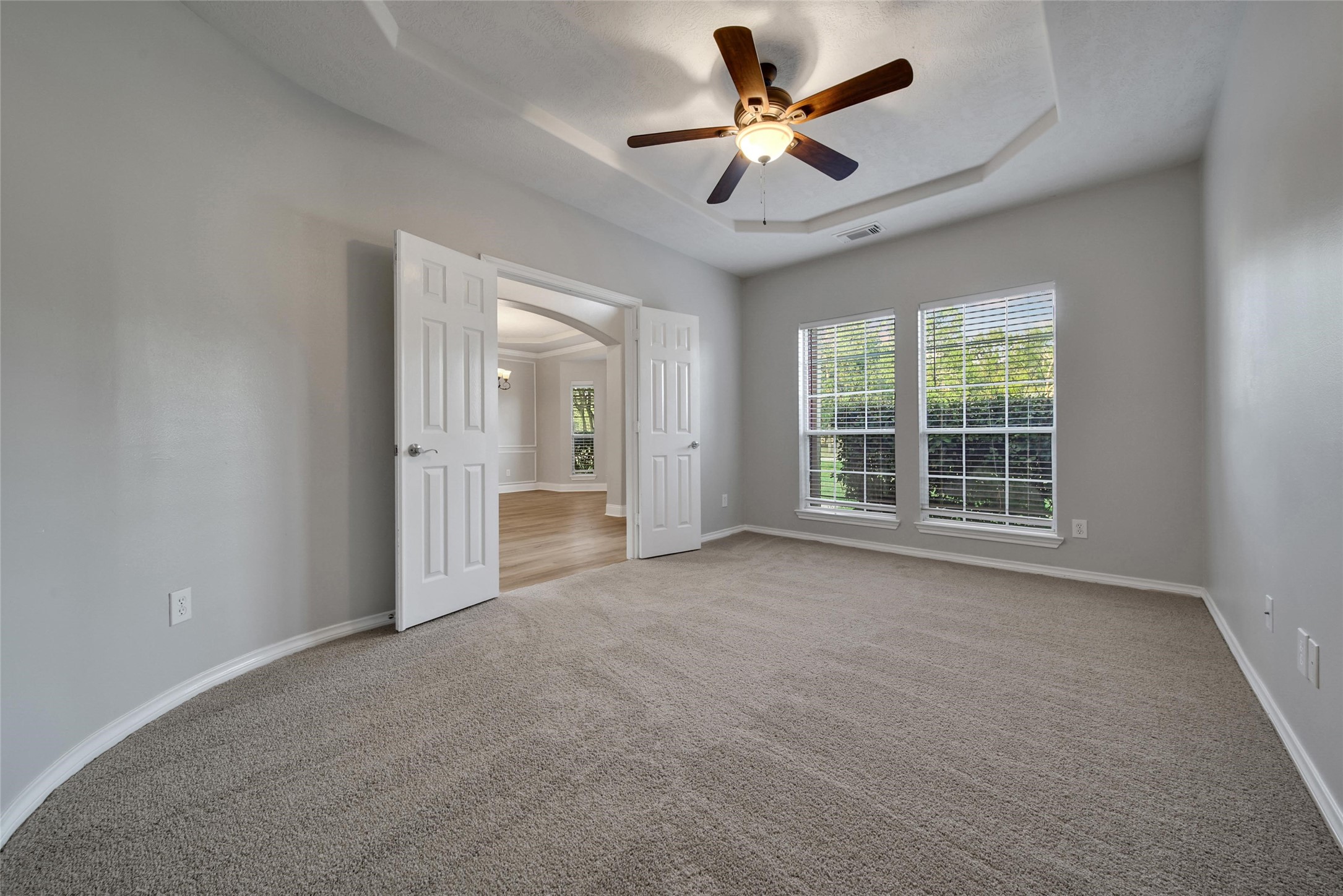 2315 Legends Gate Drive Spring, TX 77386 - Photo 16 of 50 an empty room with a ceiling fan and a window