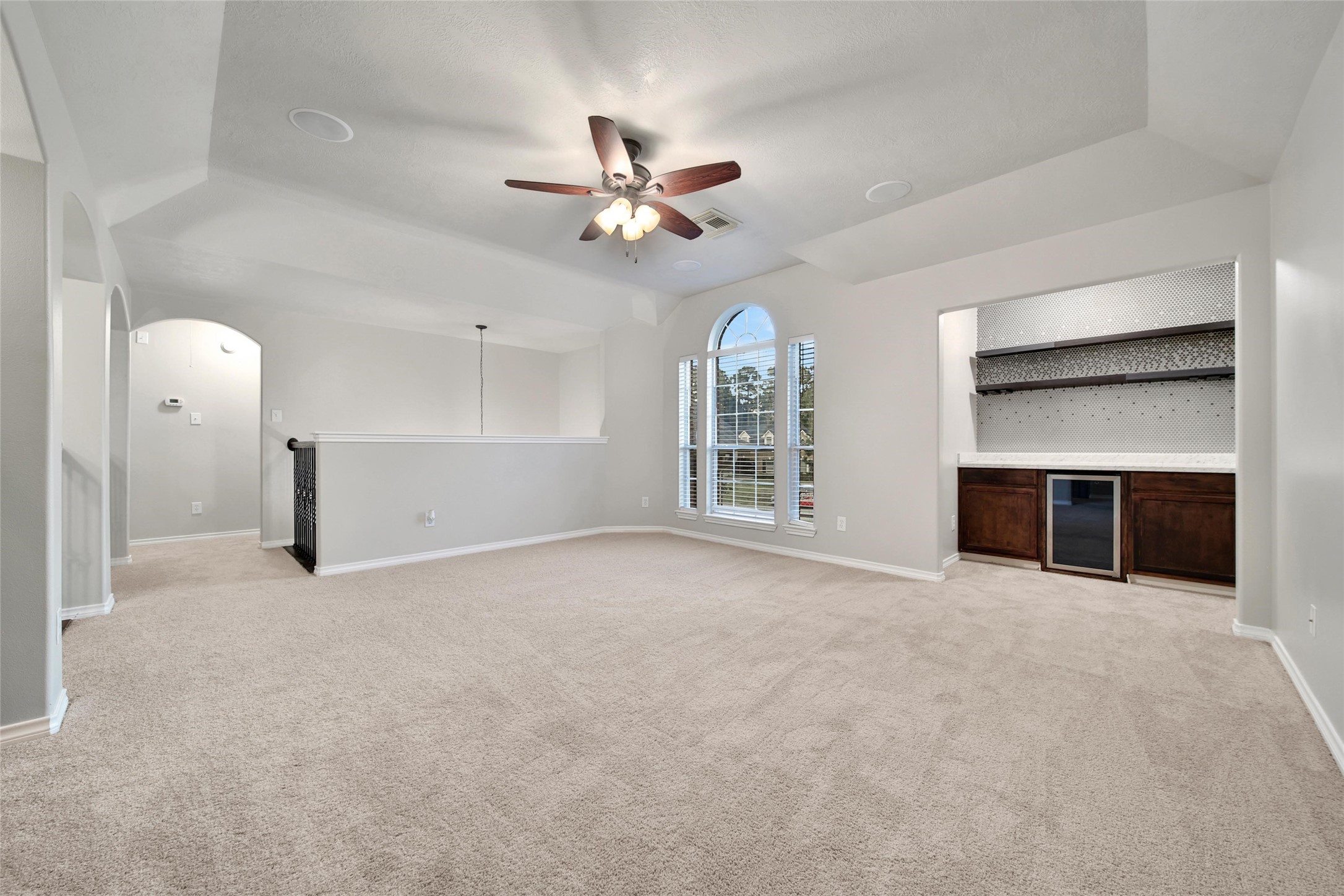 2315 Legends Gate Drive Spring, TX 77386 - Photo 23 of 50 an empty room with windows and cabinet