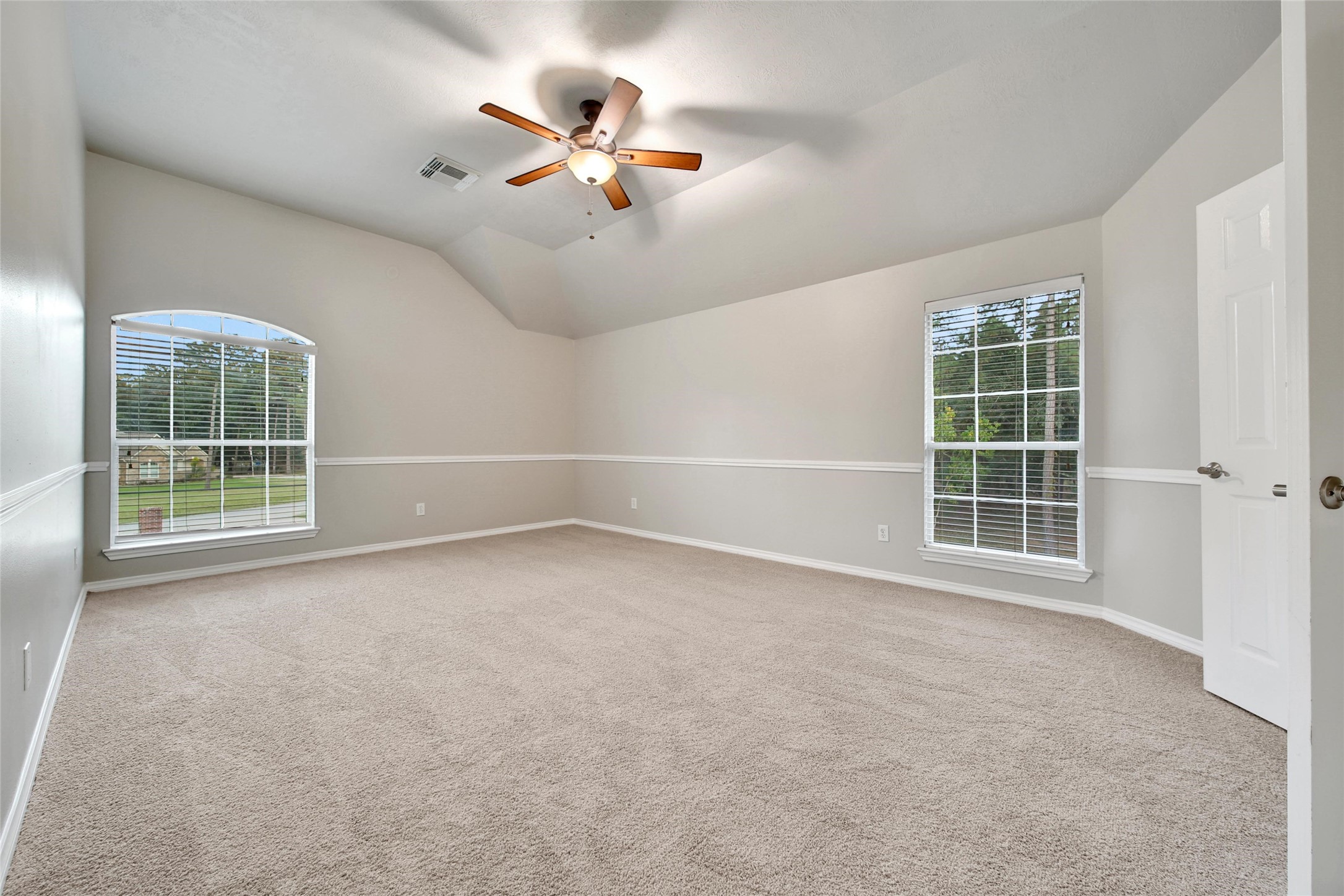 2315 Legends Gate Drive Spring, TX 77386 - Photo 27 of 50 an empty room with windows and fan