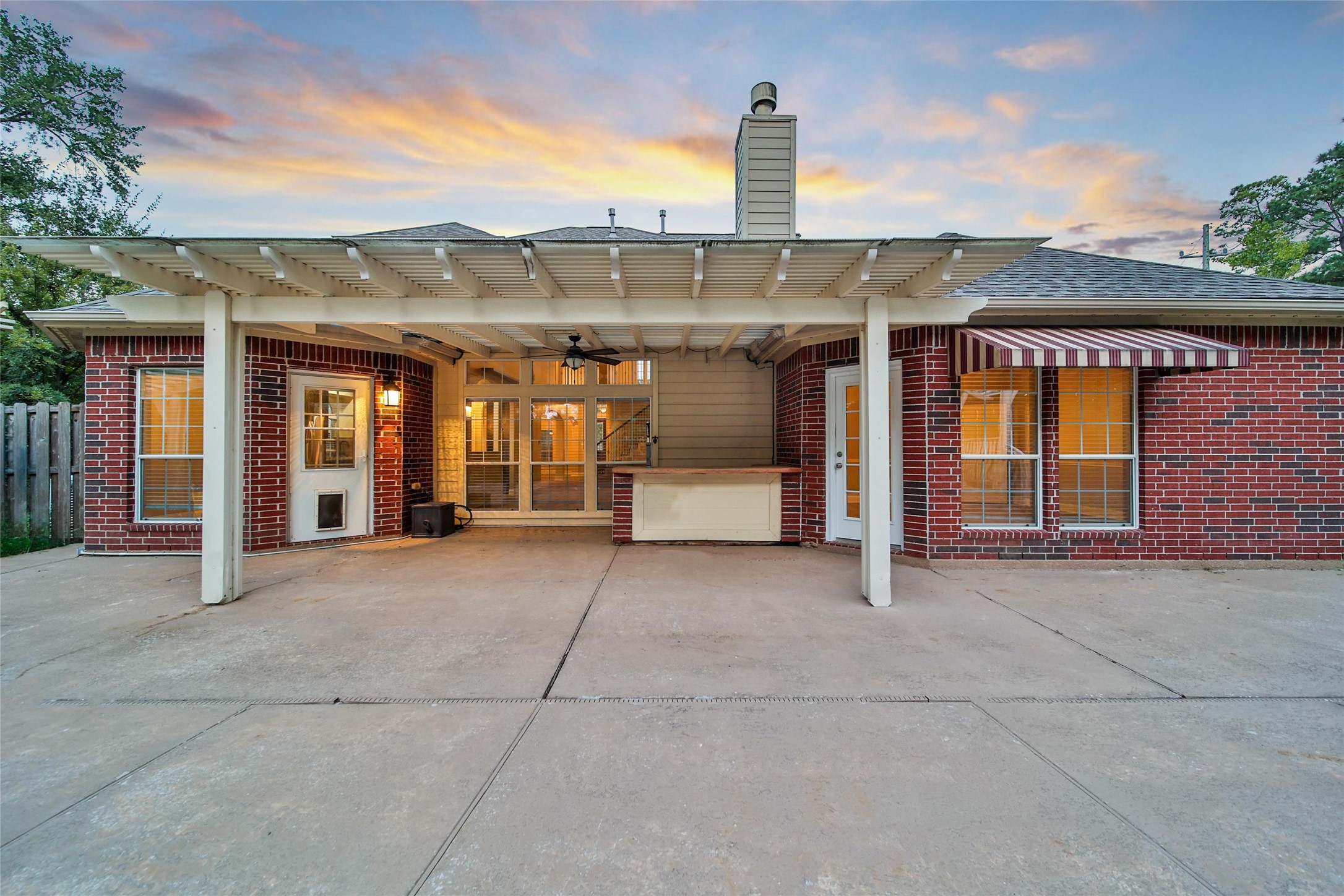 2315 Legends Gate Drive Spring, TX 77386 - Photo 36 of 50 a front view of a building with barbeque grill and floor to ceiling window