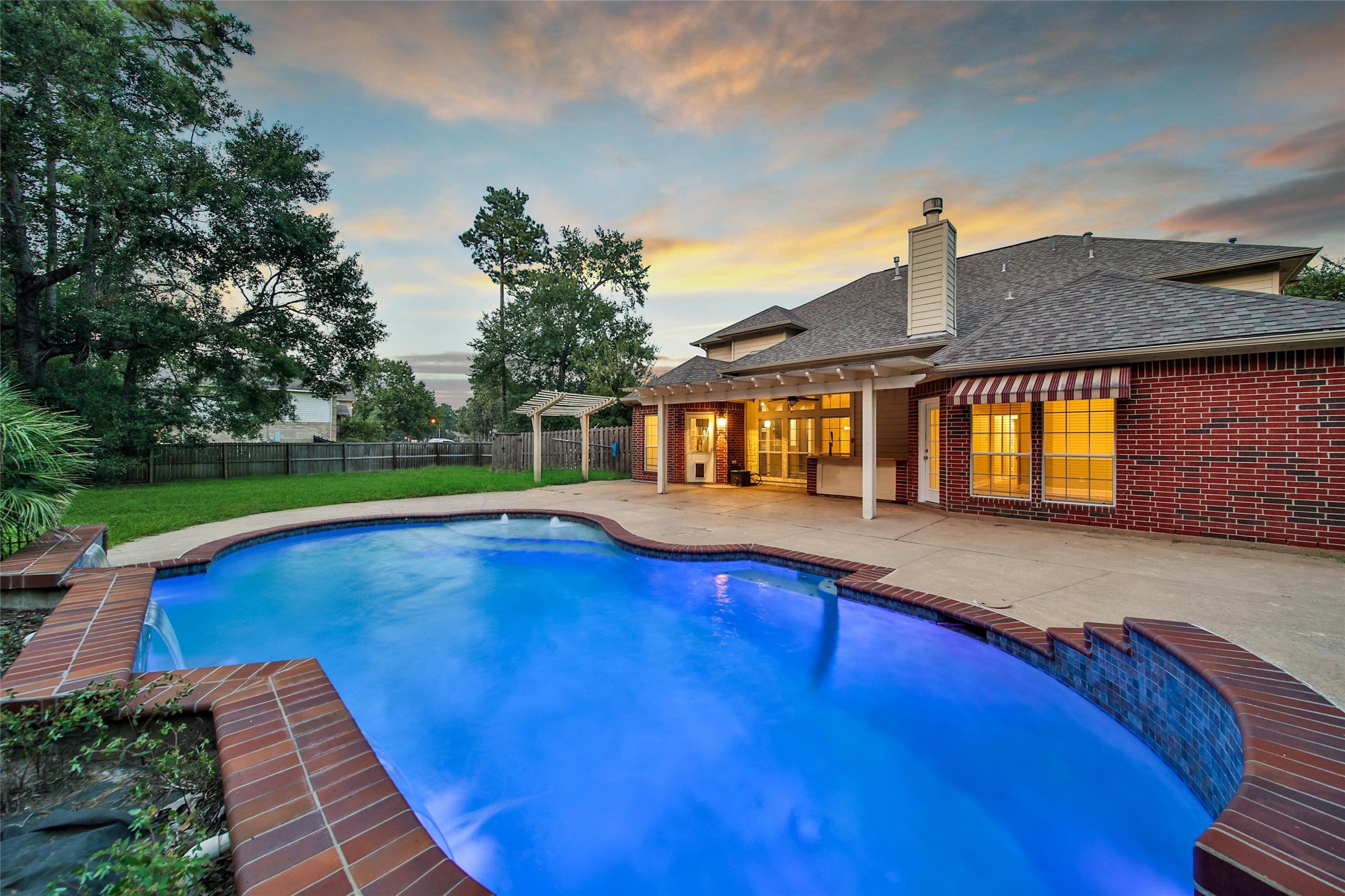 2315 Legends Gate Drive Spring, TX 77386 - Photo 39 of 50 a view of pool with umbrella and wooden fence