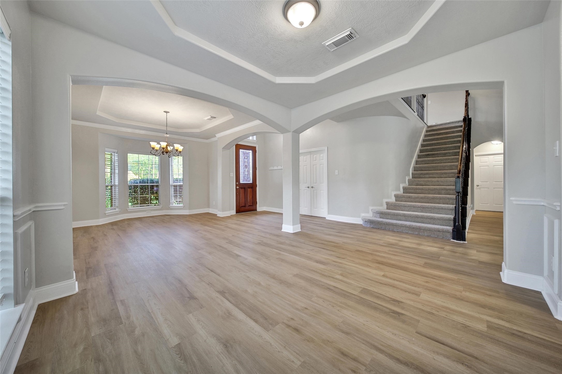 2315 Legends Gate Drive Spring, TX 77386 - Photo 4 of 50 wooden floor in an empty room with a mirror