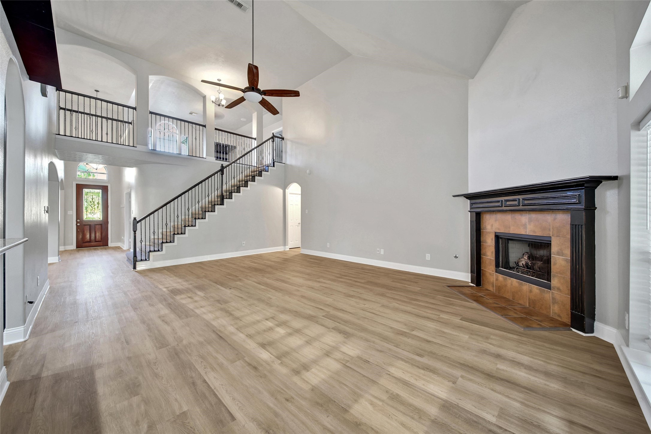 2315 Legends Gate Drive Spring, TX 77386 - Photo 5 of 50 a view of empty room with wooden floor and fireplace