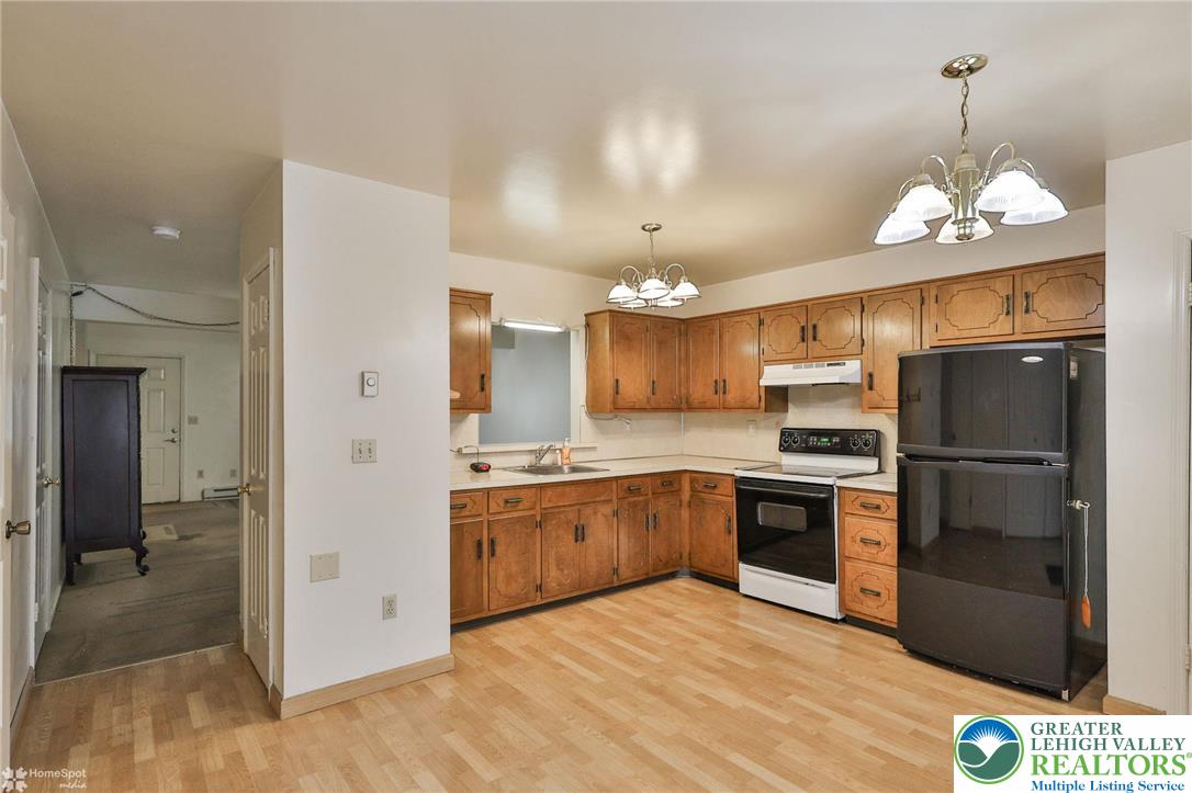 822 Elm Street Bethlehem, PA 18018 - Photo 11 of 40 a kitchen with stainless steel appliances granite countertop a refrigerator a stove a sink and a refrigerator