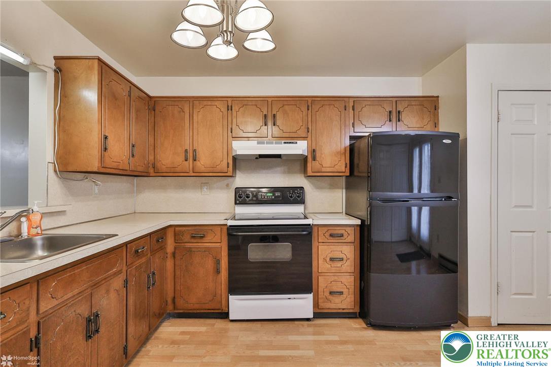 822 Elm Street Bethlehem, PA 18018 - Photo 15 of 40 a kitchen with stainless steel appliances granite countertop a refrigerator and a sink